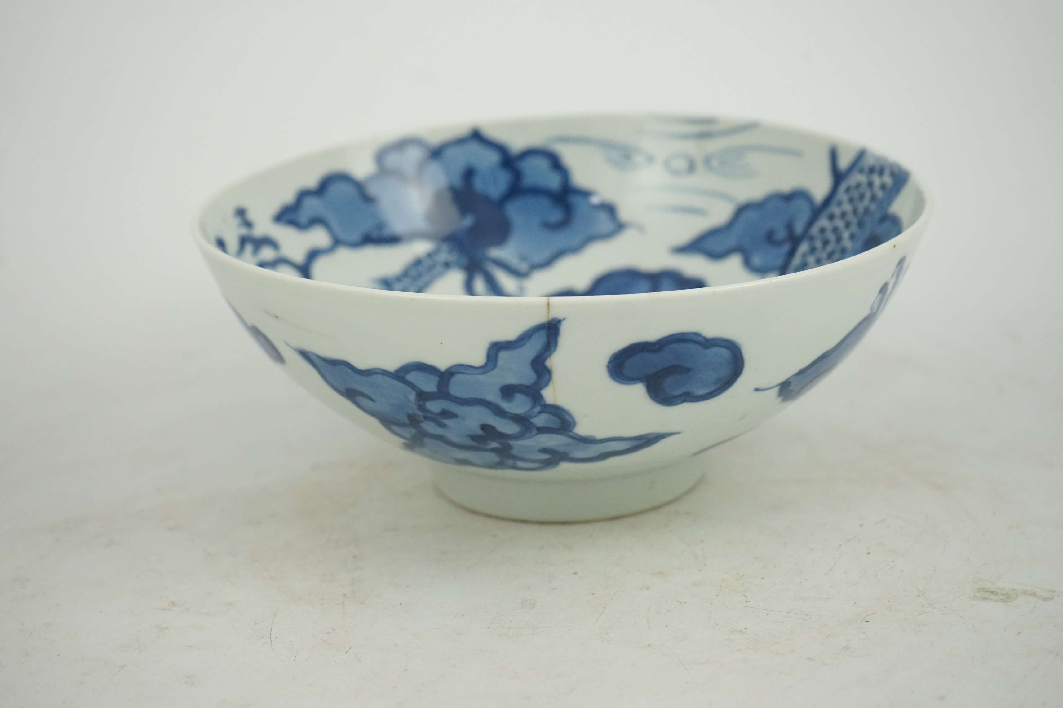 A Chinese blue and white ‘cloud and dragon’ bowl, Yongzheng mark and period (1723-35)